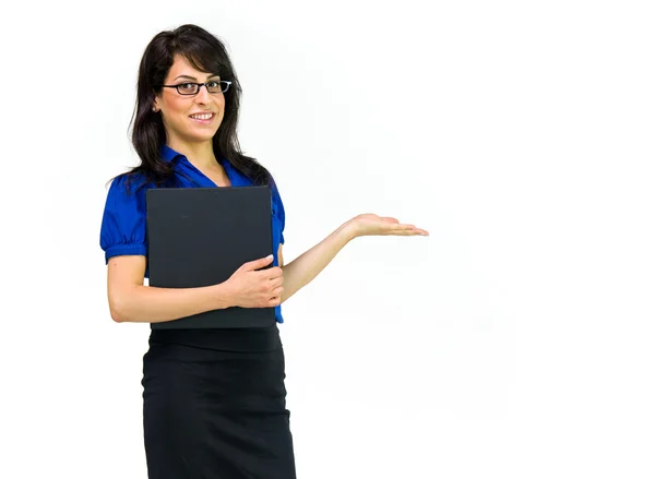 Young businesswoman presenting with hand — Stock Photo, Image