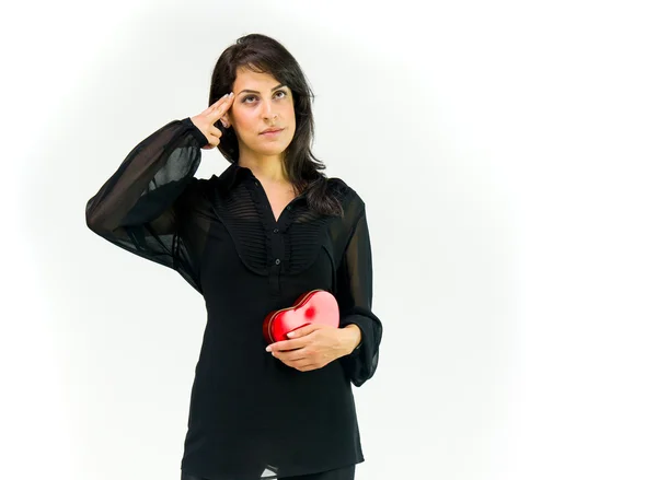 Woman with heart shooting her head — Stock Photo, Image