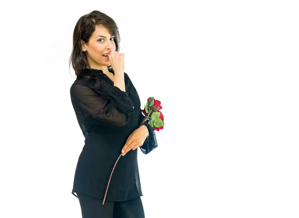 Beautiful woman with flowers biting nails — Stock Photo, Image