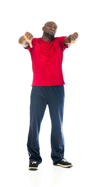 Atleta en forma hombre mostrando pulgares hacia abajo —  Fotos de Stock