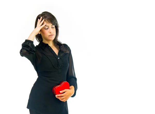 Sad woman with heart having headache — Stock Photo, Image