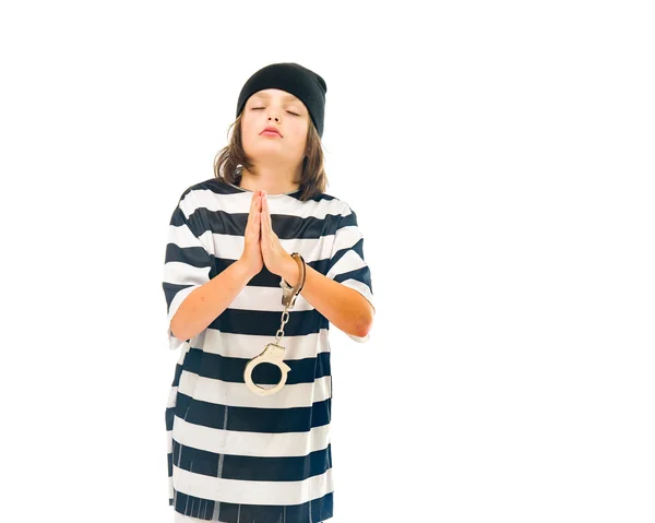 Tiener jongen gevangene bidden — Stockfoto