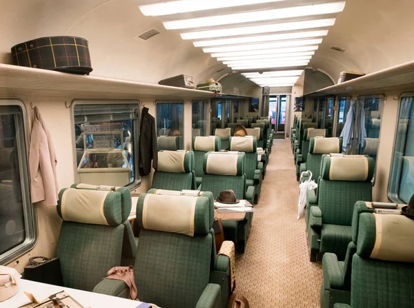 Empty green seats with cushions in train carriage — Stock Photo, Image