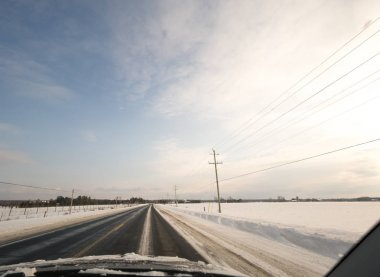 Driving on road in winter clipart