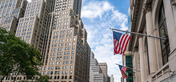 American flags hanging from building exterior, New York City, USA