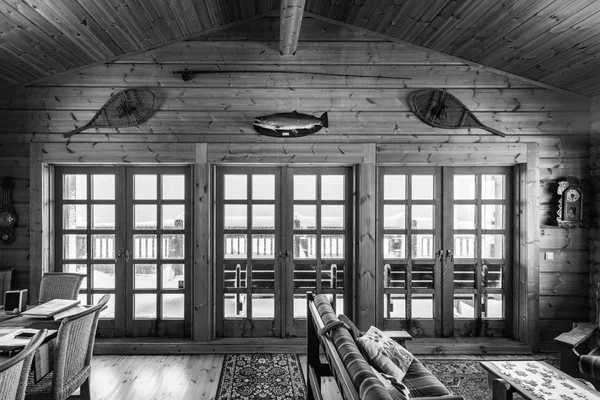 Wood clad Lliving room and doors in log cabin — Stock Photo, Image