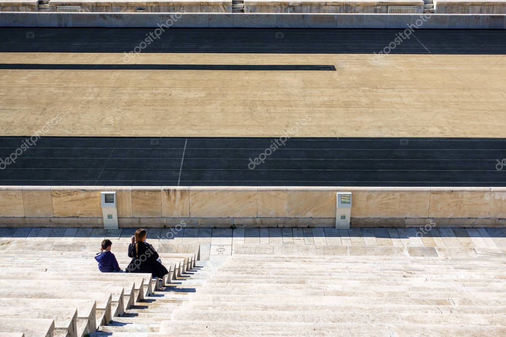 High angle view of young woman with her son on the bleachers, Panathinaiko Stadium, Athens, Greece, Europe