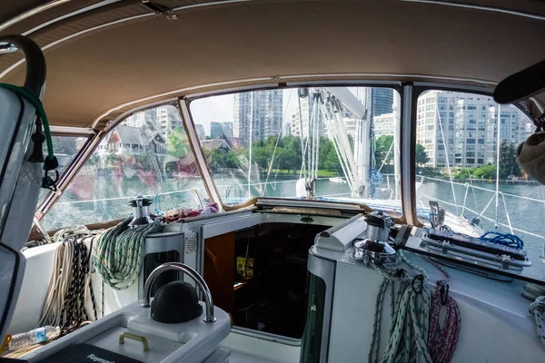 View of city buildings through boat cabin, Toronto, Canada
