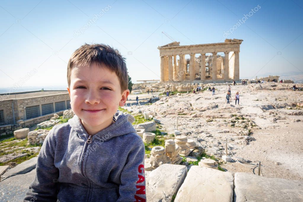 Portrait of boy in front of Parthenon of Acropolis, Athens, Greece