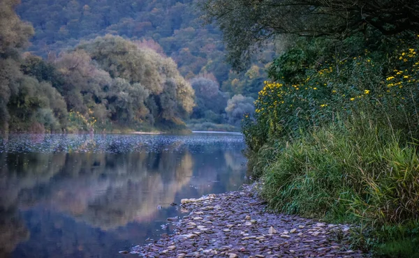 Landscapes of autumn Carpathian lakes and rivers