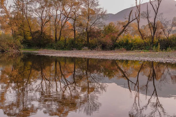 Landscapes of autumn Carpathian lakes and rivers