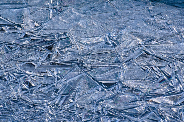 The play of the light of the sun, ice and water on a mountain river