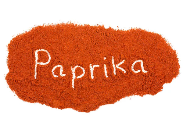 Palavra Paprika escrito em pó de ervas — Fotografia de Stock