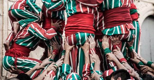 People working as a team building a human tower — Stock Photo, Image