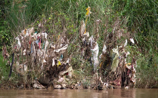 Plastic trash at the riverbank of the Dokhtawady River near Hsipaw, Myanmar, south-east Asia.