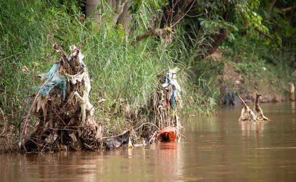 Plastic trash at the riverbank of the Dokhtawady River near Hsipaw, Myanmar, south-east Asia.