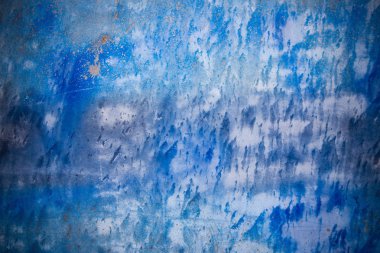 Metal üzerine mürekkep dokusu olan mavi arka plan.