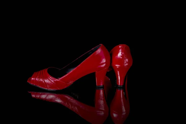 Female Red Leather Shoe on Black Background — Stock Photo, Image