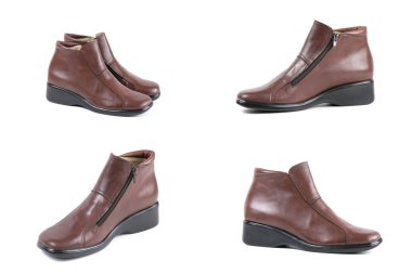 Beyaz arka plan üstünde kadın kahverengi deri çizme