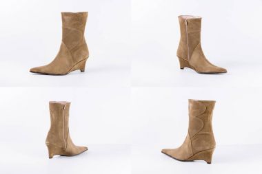 Beyaz arka plan üstünde kadın kahverengi deri çizme