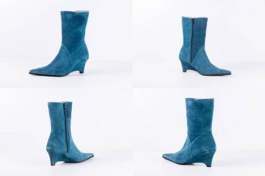 Beyaz arka plan üstünde kadın mavi deri çizme