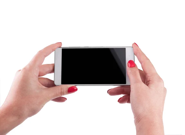 Рука женщины держит и трогает смартфон — стоковое фото