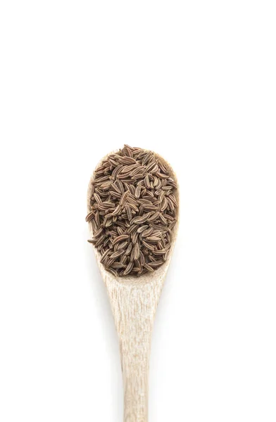 Especia seca comino en cuchara de madera aislada en blanco — Foto de Stock