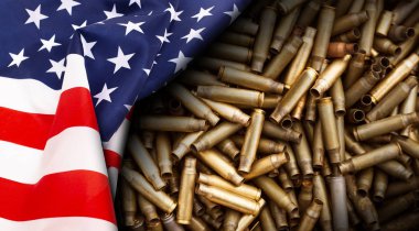 American flag isolated on shotgun cartridges background clipart