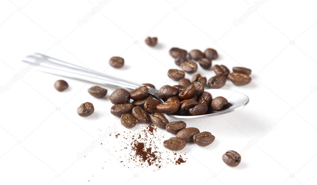 Spoon with coffee beans, macro photo. Isolated on white background.