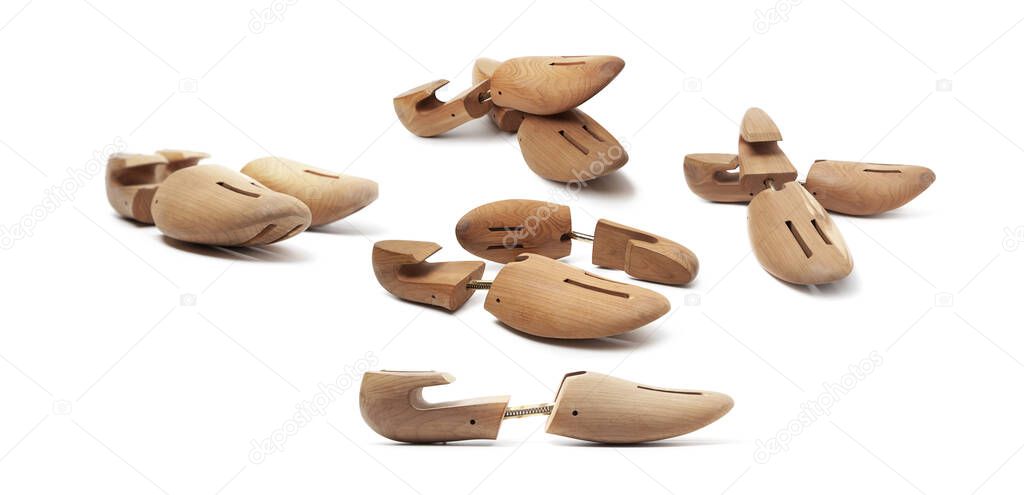 Group of wooden shoe pads and stretchers isolated on a white background.