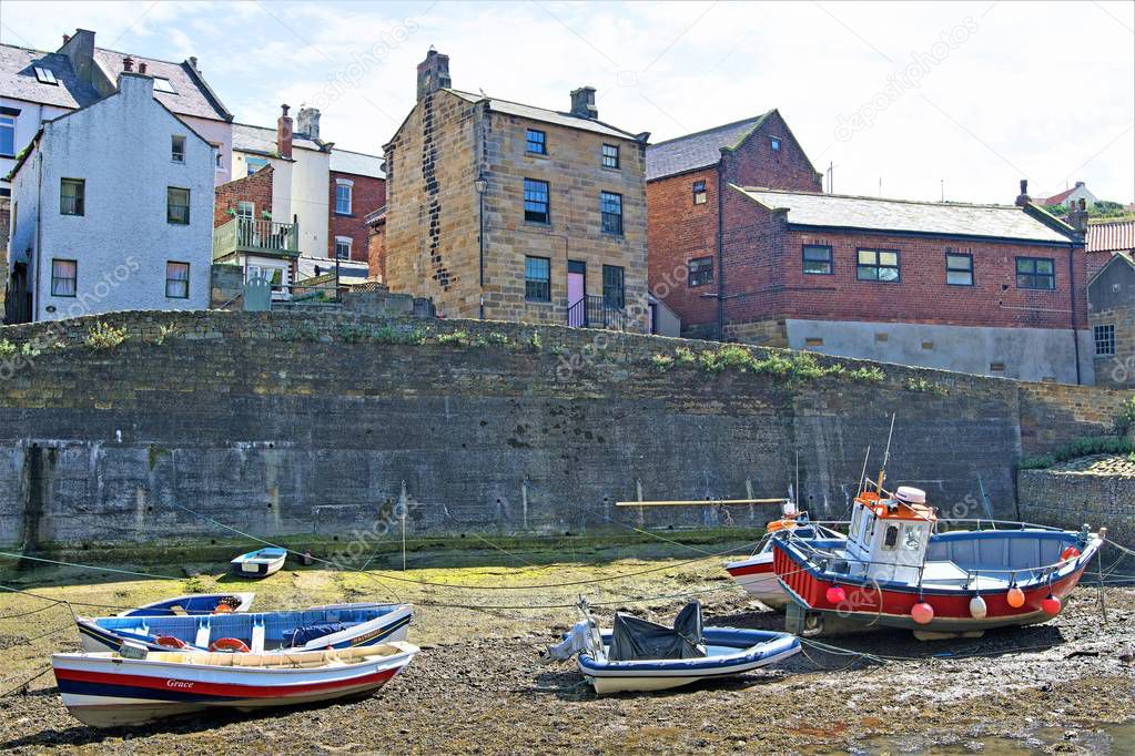 Staithes is a seaside village in the Scarborough Borough of North Yorkshire, England. Easington and Roxby Becks, two brooks that run into Staithes Beck, form the border between the Borough of Scarborough and Redcar and Cleveland.  