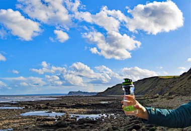 Reduce plastic pollution in the sea and oceans, by using recyclable water bottles with water filters.  Burniston Rocks is a little known hidden gem, along the Cleveland Way, between Scarborough and Ravenscar. clipart