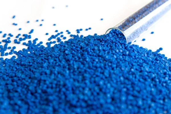 Close-up of plastic polymer granules. hand hold Polymer pellets.