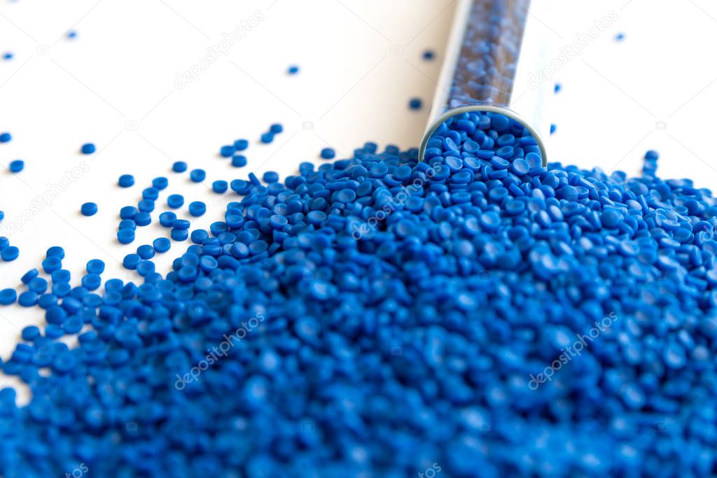 Close-up of plastic polymer granules. hand hold Polymer pellets.