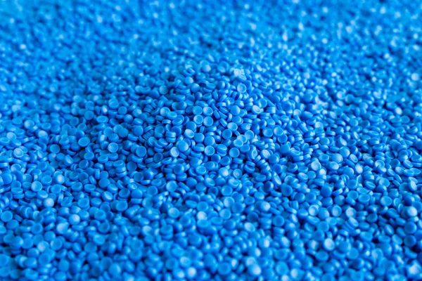 Close-up of plastic polymer granules. hand hold Polymer pellets.