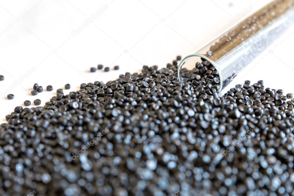 Close-up of plastic polymer granules. hand hold Polymer pellets.