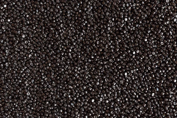 Close-up of plastic polymer granules. hand hold Polymer pellets. polymer plastic. compound polymer.