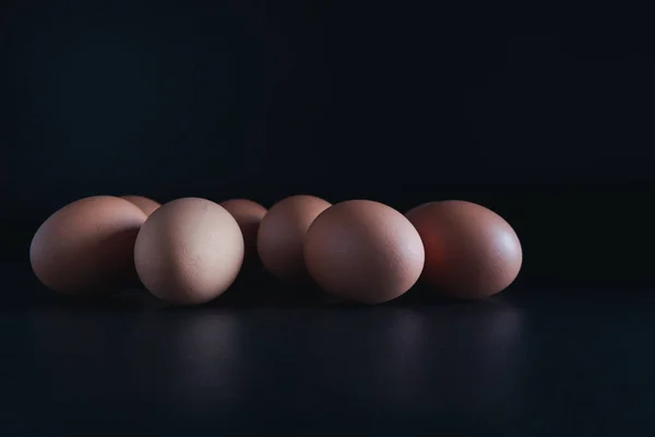 chicken eggs on black background. Eggs with copy space concept.Eggs with copy space concept