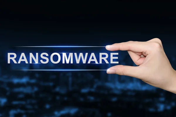 Hand clicking ransomware button — Stock Photo, Image