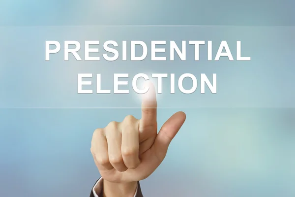 Main d'affaires cliquant sur le bouton élection présidentielle — Photo