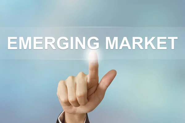 Business hand clicking emerging market button — Stock Photo, Image
