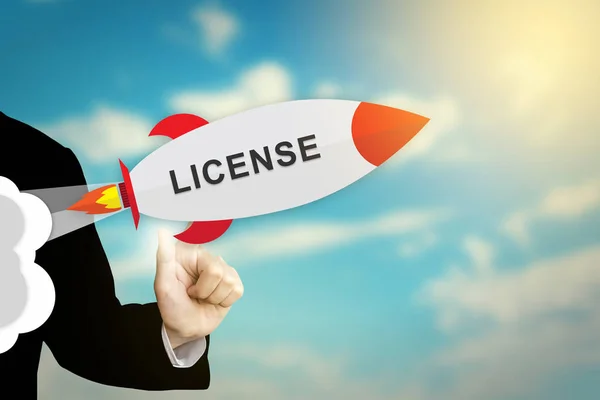 Business hand clicking license rocket — Stock Photo, Image