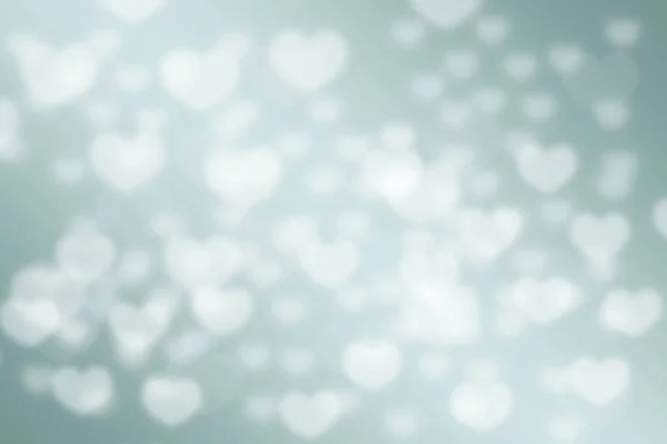 Green pastel love hearts bokeh blurred background — Stock Photo, Image