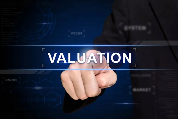Business hand pushing valuation button on virtual screen — Stock Photo, Image