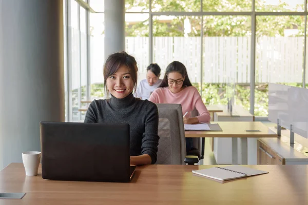 Young beautiful businesswoman working in startup office — Stock Photo, Image