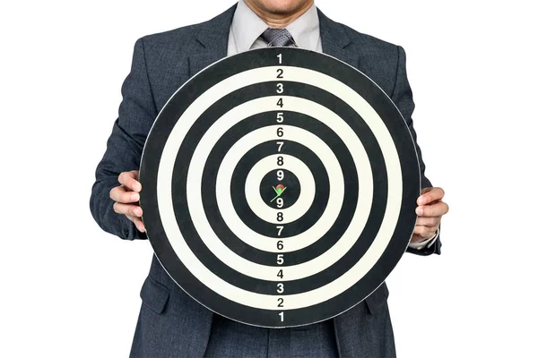 Businessman hold dartboard with arrow hitting the target — Stock Photo, Image