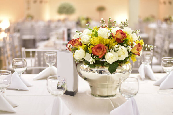 Table setting with glasses, plates, napkins and food