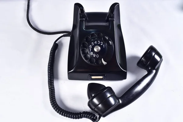 vintage black old telephone handset on white background.