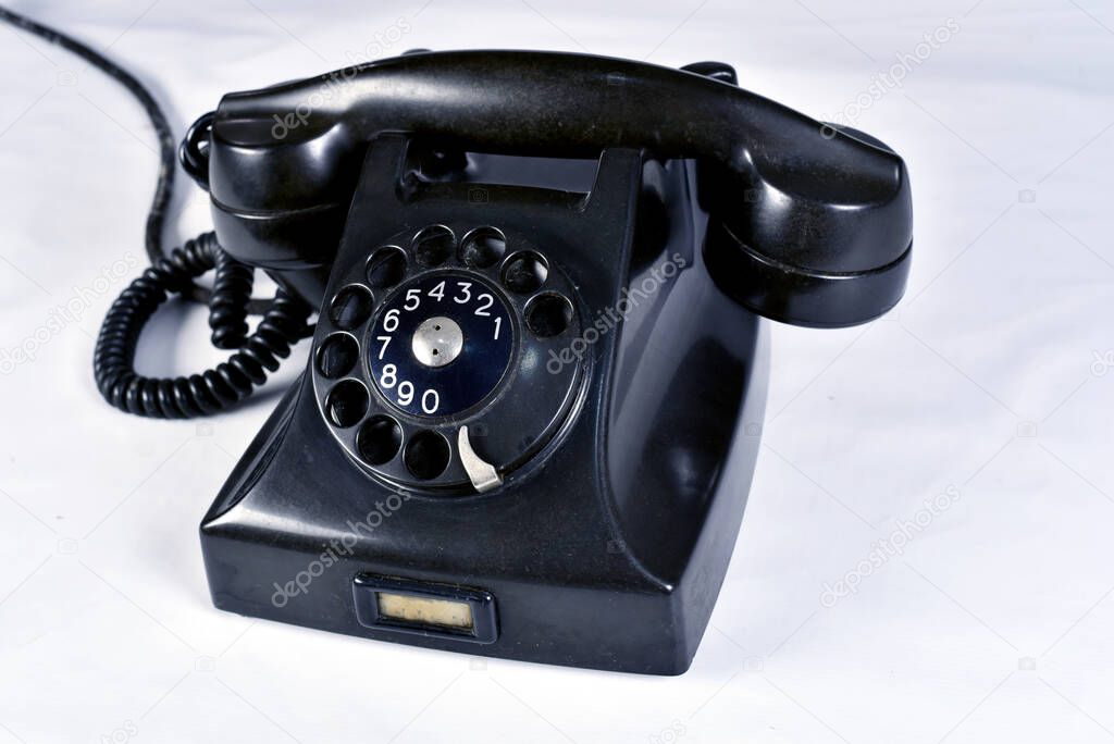 vintage black old telephone handset on white background.