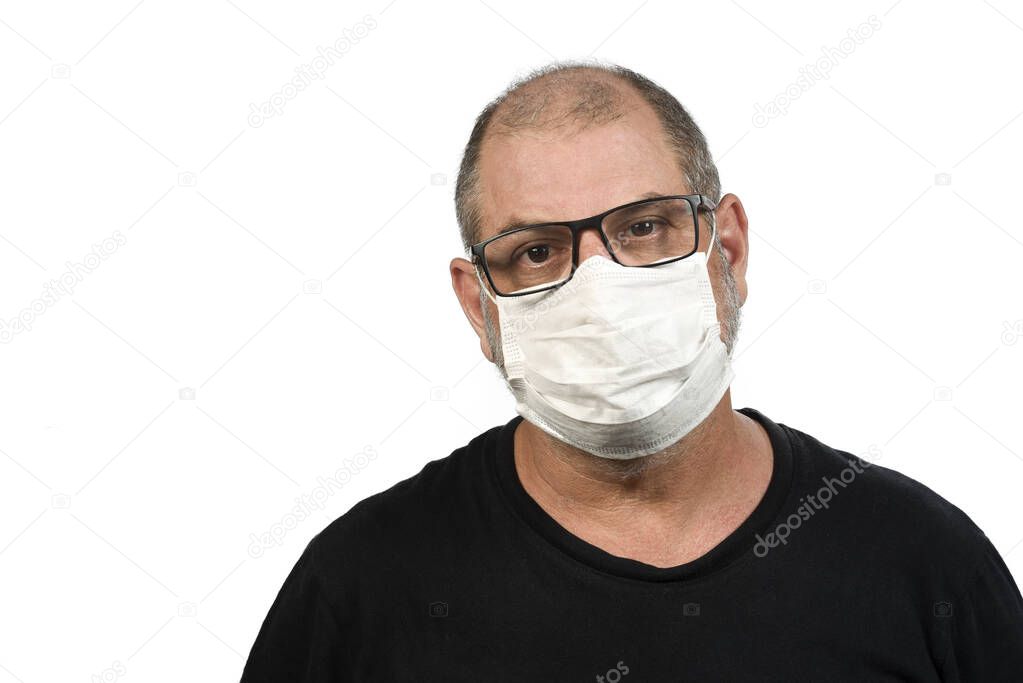 Portrait of a man, in a medical mask using alcohol gel. A concept of the danger of COVID-19 coronavirus for the elderly. on white background with space for text